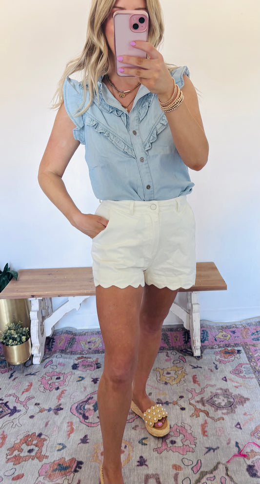 Light denim ruffle button blouse